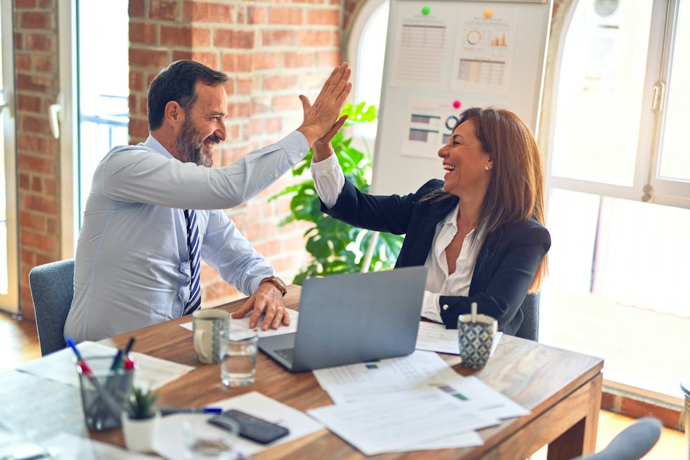 Consultants discussing strategy with clients